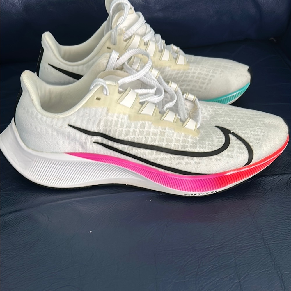Nike White and Pink Athletic Shoes with Breathable Design